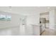 Open-concept living space with tile flooring adjacent to the kitchen at 1817 Draughton Dr, Zephyrhills, FL 33541