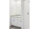 Bathroom with a single vanity, granite countertops, and a white tiled shower at 3539 Moscato Dr, Brooksville, FL 34602