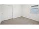 A cozy bedroom with closet space and natural light from a window at 3539 Moscato Dr, Brooksville, FL 34602