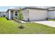 Charming one-story home with a well-manicured lawn and a two-car garage at 3539 Moscato Dr, Brooksville, FL 34602