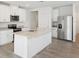 Modern kitchen featuring an island, stainless steel appliances, and granite countertops at 3539 Moscato Dr, Brooksville, FL 34602