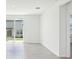 Bright, open living area with sliding glass doors and tile flooring at 3539 Moscato Dr, Brooksville, FL 34602