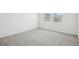 Bedroom with carpet and natural lighting, with white walls and ample sunlight at 3547 Moscato Dr, Brooksville, FL 34602