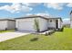 Charming single-story home with a well-manicured lawn and attached two-car garage at 3547 Moscato Dr, Brooksville, FL 34602