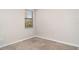 Neutral carpeted bedroom features a window and freshly painted walls at 13244 Satin Lily Dr, Riverview, FL 33579