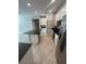Bright kitchen with stainless steel appliances, an island, and granite countertops at 13244 Satin Lily Dr, Riverview, FL 33579