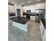 Modern kitchen featuring stainless steel appliances, granite countertops, and white cabinets at 13244 Satin Lily Dr, Riverview, FL 33579