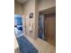 Bathroom featuring a walk-in shower, tile floors, vanity and door to an adjacent bedroom at 1835 Rival Ter, North Port, FL 34286