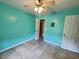 This bedroom has a ceiling fan and a storage closet with adjustable shelving at 1835 Rival Ter, North Port, FL 34286