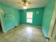 Cozy bedroom with tiled flooring, natural light, and pleasant decor at 1835 Rival Ter, North Port, FL 34286