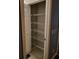 Pantry closet featuring wire shelving, tiled floor, and a single door at 1835 Rival Ter, North Port, FL 34286