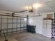 Garage with ample storage, door opener, and organization options at 1835 Rival Ter, North Port, FL 34286