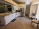 Bright kitchen featuring stainless steel appliances, white cabinets, and stone countertops at 1835 Rival Ter, North Port, FL 34286