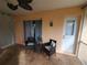 Outdoor patio with tiled floors, seating and an open backyard view with natural light at 1835 Rival Ter, North Port, FL 34286