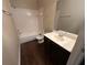 Bathroom with a tub and shower combo, and dark cabinets at 3805 N Cranberry Blvd, North Port, FL 34286