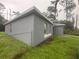 A modern home has a neutral exterior color and standard windows at 3805 N Cranberry Blvd, North Port, FL 34286