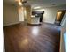 Spacious living room with an open floor plan and hardwood floors, leading to the kitchen at 3805 N Cranberry Blvd, North Port, FL 34286