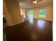 Open-concept living room with hardwood floors, sliding glass doors and lots of natural light at 3805 N Cranberry Blvd, North Port, FL 34286