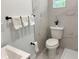 Bathroom featuring white marble tiling, updated fixtures, and modern design at 38706 8Th Ave, Zephyrhills, FL 33542