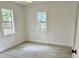 Bedroom with two windows that provide natural light and laminate flooring at 38706 8Th Ave, Zephyrhills, FL 33542