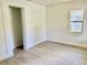 Light-filled bedroom with closet, bright paint and flooring, and a window at 38706 8Th Ave, Zephyrhills, FL 33542
