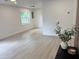 Bright and airy living room with laminate flooring and fresh paint at 38706 8Th Ave, Zephyrhills, FL 33542