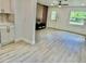 Spacious living area with modern flooring, neutral paint, and updated fixtures at 38706 8Th Ave, Zephyrhills, FL 33542