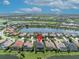 Aerial shot shows the home situated on a tranquil lake at 5531 Arnie Loop, Bradenton, FL 34211