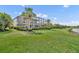 A spacious lawn and landscape of this home backs up to a golf course and pond at 5531 Arnie Loop, Bradenton, FL 34211