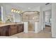 Spacious bathroom with walk-in shower, dark wood cabinets and large vanity at 5531 Arnie Loop, Bradenton, FL 34211