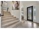 Foyer features tile flooring, staircase, art, and a decorative front door at 5531 Arnie Loop, Bradenton, FL 34211