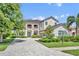 Elegant two-story home with a manicured lawn and paved driveway at 5531 Arnie Loop, Bradenton, FL 34211