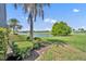 A scenic golf course with a pond offers a tranquil landscape and natural beauty at 5531 Arnie Loop, Bradenton, FL 34211