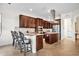 Gourmet kitchen features a breakfast bar, stainless steel appliances, granite countertops, and custom cabinets at 5531 Arnie Loop, Bradenton, FL 34211