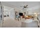 Bright living room featuring a ceiling fan and a comfortable seating area at 5531 Arnie Loop, Bradenton, FL 34211