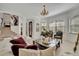 Bright living room with elegant decor, chandelier, and stairs leading to the second floor at 5531 Arnie Loop, Bradenton, FL 34211