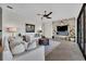 Modern living room with a marble fireplace, white sofas, and a neutral color palette at 5531 Arnie Loop, Bradenton, FL 34211