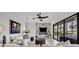 Bright living room boasts a fireplace with marble accent wall and sliding glass doors to the outdoor patio at 5531 Arnie Loop, Bradenton, FL 34211