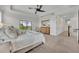 Spacious bedroom boasts access to a screened in balcony with scenic views at 5531 Arnie Loop, Bradenton, FL 34211