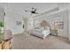 Well-lit bedroom featuring neutral tones, ceiling fan and balcony access at 5531 Arnie Loop, Bradenton, FL 34211