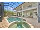 An outdoor pool and spa area are fully screened, with a covered patio and golf course views at 5531 Arnie Loop, Bradenton, FL 34211