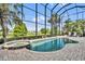 A beautiful screened pool and spa offer a private oasis for relaxation and recreation at 5531 Arnie Loop, Bradenton, FL 34211