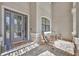 Inviting front porch with seating, decorative door, and stylish welcome mat at 5531 Arnie Loop, Bradenton, FL 34211