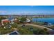 A scenic aerial view overlooking the community with lush landscaping, amenities, and a tranquil lake at 42862 Park View Dr, Punta Gorda, FL 33982