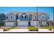 Charming townhomes featuring varied exterior colors, attached garages, and well manicured landscaping at 42862 Park View Dr, Punta Gorda, FL 33982