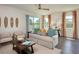 Inviting living room with stylish furnishings, lots of natural light, and access to outdoor space at 42862 Park View Dr, Punta Gorda, FL 33982