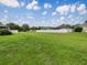 Large backyard with plenty of room to play, surrounded by a white fence at 10429 Avelar Ridge Dr, Riverview, FL 33578