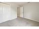 Beige carpeted bedroom with closet and doorway to the hall at 10429 Avelar Ridge Dr, Riverview, FL 33578