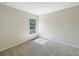 Bedroom with beige carpeting and a window allowing lots of natural light at 10429 Avelar Ridge Dr, Riverview, FL 33578