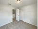 Neutral bedroom with carpet, a closet and an open door to the upstairs hall at 10429 Avelar Ridge Dr, Riverview, FL 33578